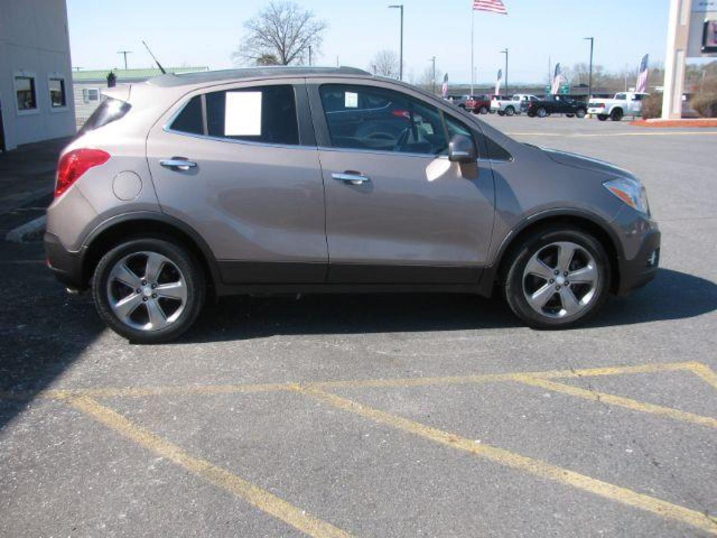 2014 Brown Buick Encore Leather FWD (KL4CJCSB7EB) with an 1.4L L4 DOHC 16V TURBO engine, 6-Speed Automatic transmission, located at 2443 Albert Pike, Hot Springs, AR, 71913, (501) 623-6255, 34.492222, -93.109993 - Photo#4