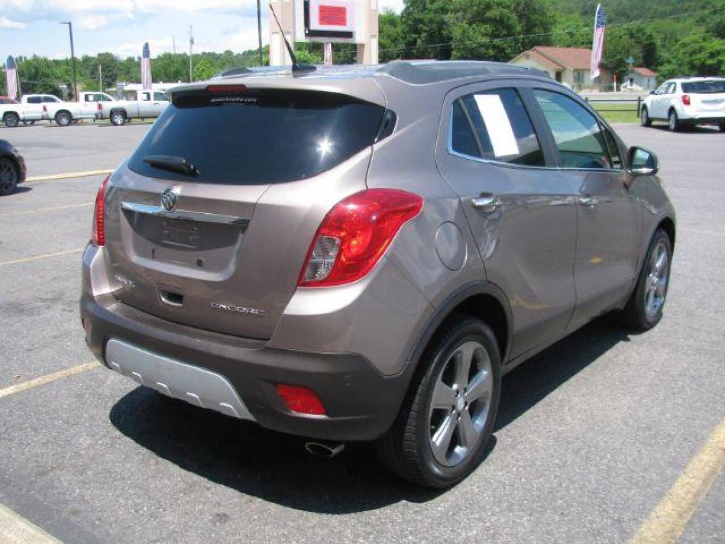 2014 Brown Buick Encore Leather FWD (KL4CJCSB7EB) with an 1.4L L4 DOHC 16V TURBO engine, 6-Speed Automatic transmission, located at 2443 Albert Pike, Hot Springs, AR, 71913, (501) 623-6255, 34.492222, -93.109993 - Photo#2