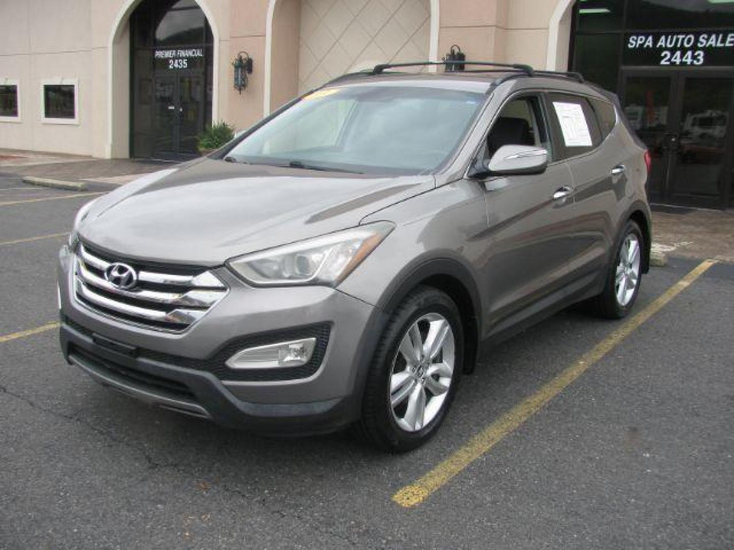 2013 Brown Hyundai Santa Fe Sport 2.0 FWD (5XYZU3LA4DG) with an 2.0L L4 DOHC 16V engine, 6-Speed Automatic transmission, located at 2443 Albert Pike, Hot Springs, AR, 71913, (501) 623-6255, 34.492222, -93.109993 - Photo#0