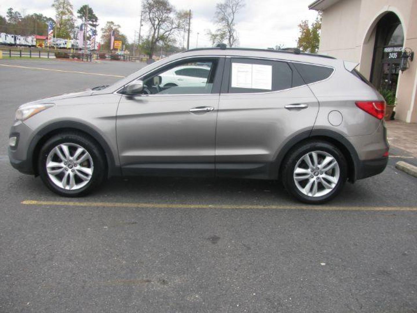 2013 Brown Hyundai Santa Fe Sport 2.0 FWD (5XYZU3LA4DG) with an 2.0L L4 DOHC 16V engine, 6-Speed Automatic transmission, located at 2443 Albert Pike, Hot Springs, AR, 71913, (501) 623-6255, 34.492222, -93.109993 - Photo#1