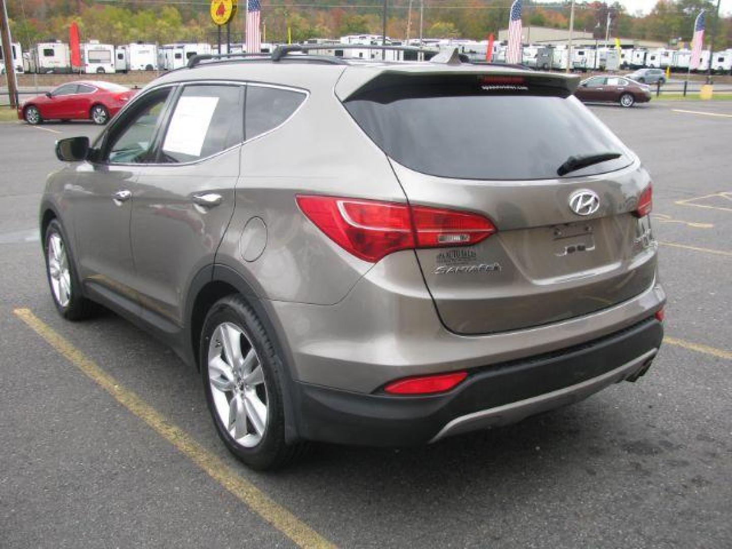 2013 Brown Hyundai Santa Fe Sport 2.0 FWD (5XYZU3LA4DG) with an 2.0L L4 DOHC 16V engine, 6-Speed Automatic transmission, located at 2443 Albert Pike, Hot Springs, AR, 71913, (501) 623-6255, 34.492222, -93.109993 - Photo#2