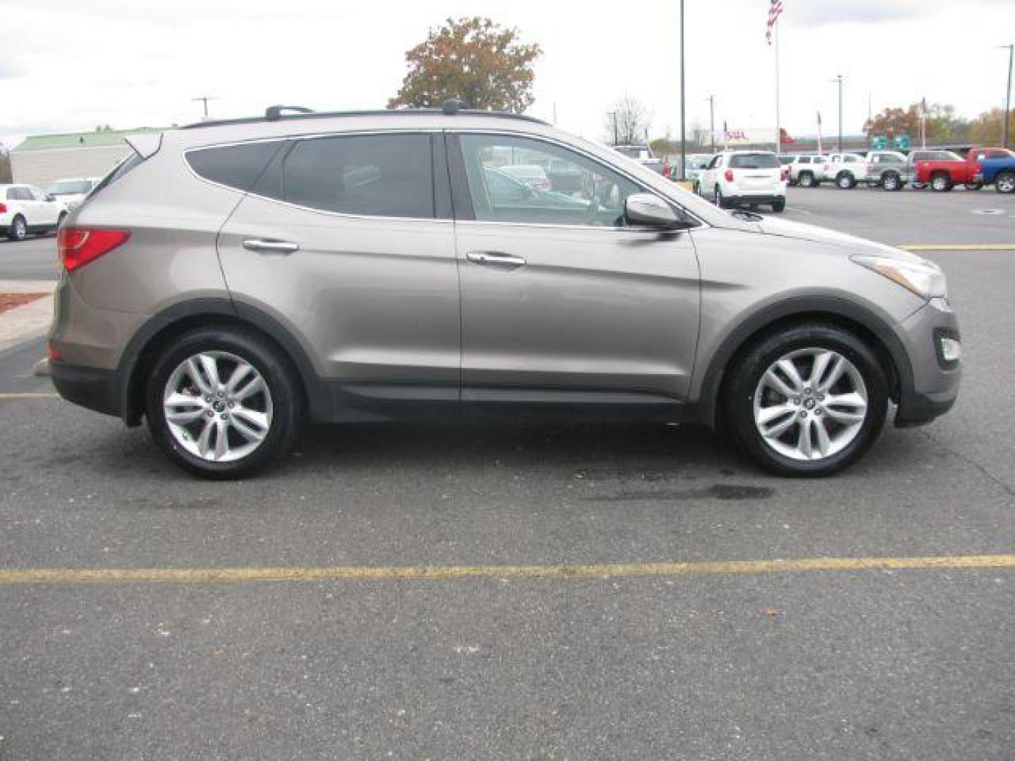 2013 Brown Hyundai Santa Fe Sport 2.0 FWD (5XYZU3LA4DG) with an 2.0L L4 DOHC 16V engine, 6-Speed Automatic transmission, located at 2443 Albert Pike, Hot Springs, AR, 71913, (501) 623-6255, 34.492222, -93.109993 - Photo#4