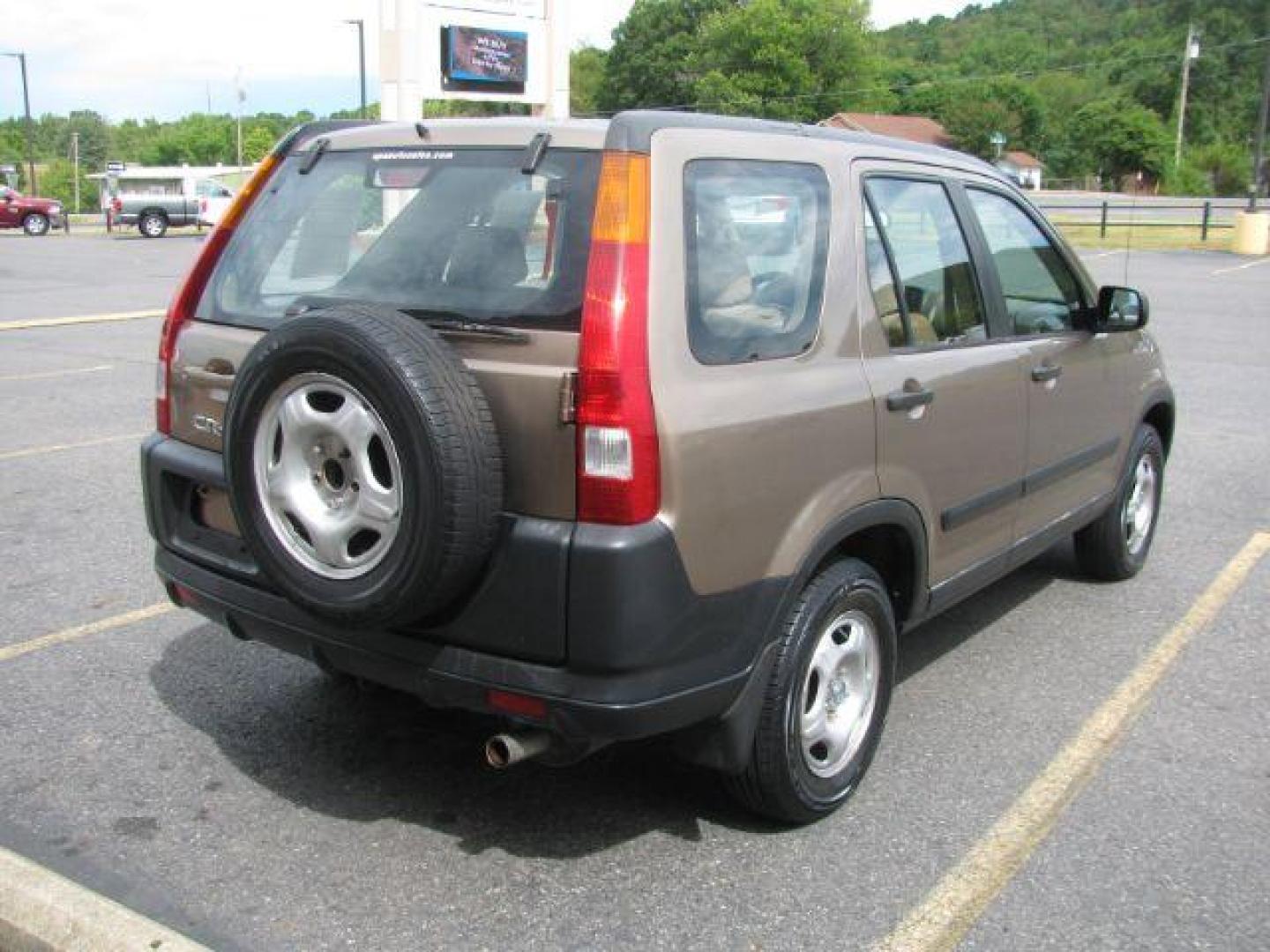 2004 Brown Honda CR-V LX 2WD AT (JHLRD68434C) with an 2.4L L4 DOHC 16V engine, 4-Speed Automatic transmission, located at 2443 Albert Pike, Hot Springs, AR, 71913, (501) 623-6255, 34.492222, -93.109993 - Photo#3