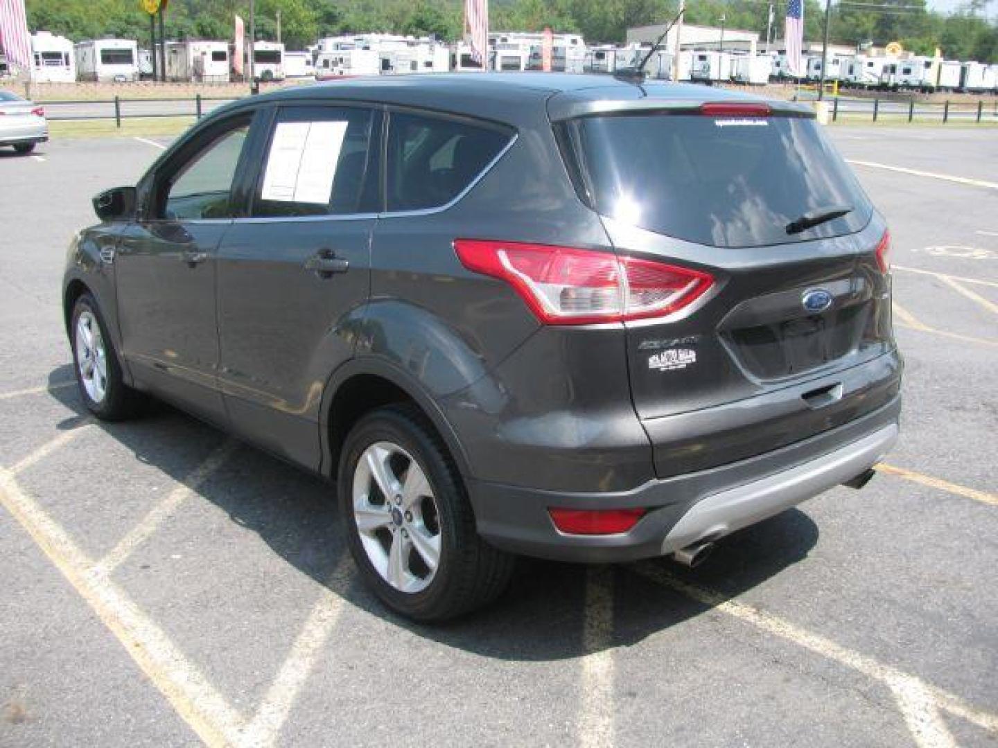 2016 Gray Ford Escape SE FWD (1FMCU0G75GU) with an 2.5L L4 DOHC 16V engine, 6-Speed Automatic transmission, located at 2443 Albert Pike, Hot Springs, AR, 71913, (501) 623-6255, 34.492222, -93.109993 - Photo#2