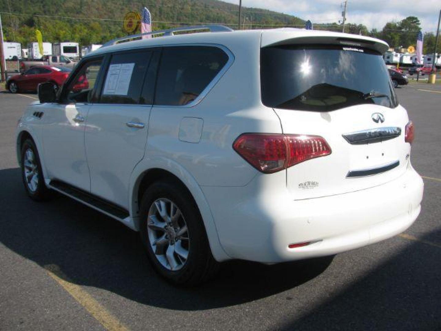 2013 White Infiniti QX56 4WD (JN8AZ2NE5D9) with an 5.6L V8 DOHC 32V engine, 5-Speed Automatic transmission, located at 2443 Albert Pike, Hot Springs, AR, 71913, (501) 623-6255, 34.492222, -93.109993 - Photo#2