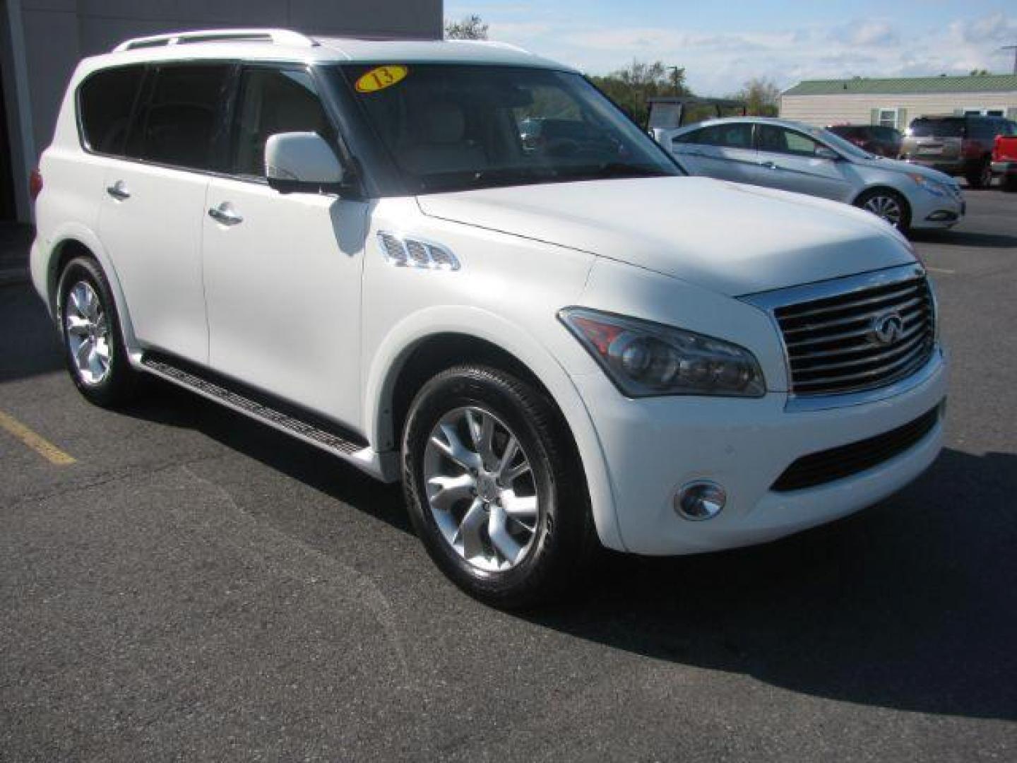 2013 White Infiniti QX56 4WD (JN8AZ2NE5D9) with an 5.6L V8 DOHC 32V engine, 5-Speed Automatic transmission, located at 2443 Albert Pike, Hot Springs, AR, 71913, (501) 623-6255, 34.492222, -93.109993 - Photo#5