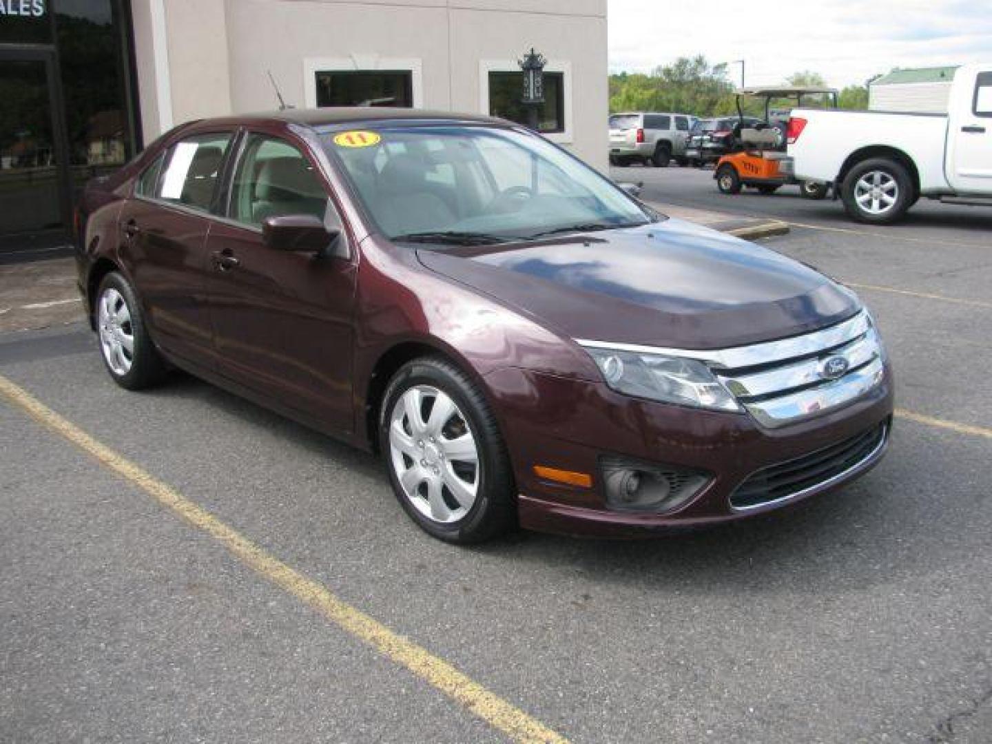 2011 Maroon Ford Fusion I4 SE (3FAHP0HA0BR) with an 2.5L L4 DOHC 16V engine, located at 2443 Albert Pike, Hot Springs, AR, 71913, (501) 623-6255, 34.492222, -93.109993 - LISTED FEATURES MAY BE OPTIONAL AND NOT INCLUDED ON THIS VEHICLE!!! - Photo#0