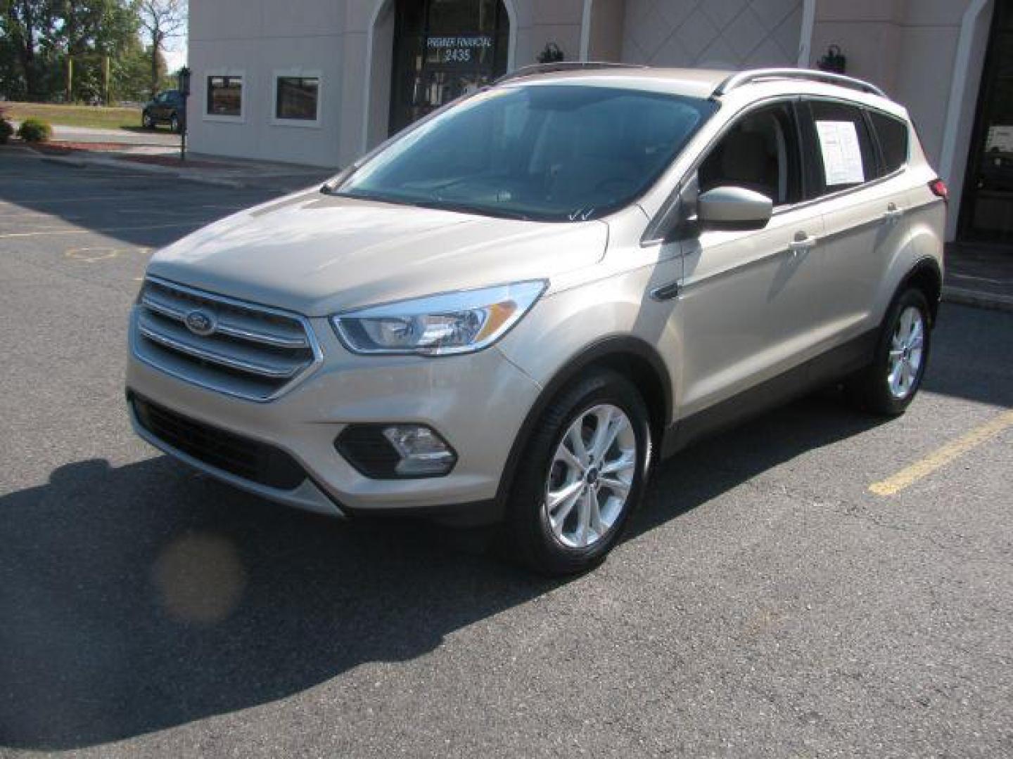 2018 Tan Ford Escape SE FWD (1FMCU0GD2JU) with an 1.5L L4 DOHC 16V engine, 6-Speed Automatic transmission, located at 2443 Albert Pike, Hot Springs, AR, 71913, (501) 623-6255, 34.492222, -93.109993 - Photo#0