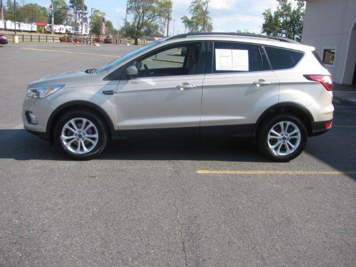 2018 Tan Ford Escape SE FWD (1FMCU0GD2JU) with an 1.5L L4 DOHC 16V engine, 6-Speed Automatic transmission, located at 2443 Albert Pike, Hot Springs, AR, 71913, (501) 623-6255, 34.492222, -93.109993 - Photo#1