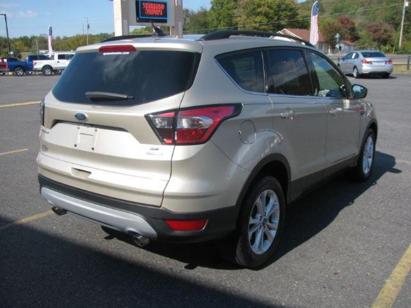 2018 Tan Ford Escape SE FWD (1FMCU0GD2JU) with an 1.5L L4 DOHC 16V engine, 6-Speed Automatic transmission, located at 2443 Albert Pike, Hot Springs, AR, 71913, (501) 623-6255, 34.492222, -93.109993 - Photo#3