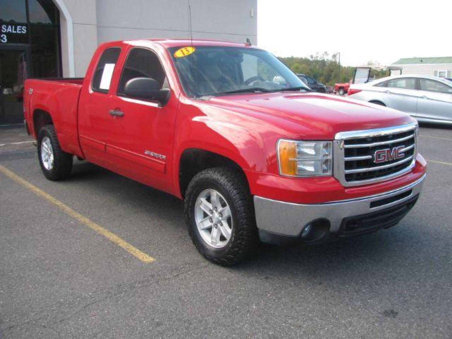 2013 Red GMC Sierra 1500 SLE Ext. Cab 4WD (1GTR2VE73DZ) with an 5.3L V8 OHV 16V FFV engine, 6-Speed Automatic transmission, located at 2443 Albert Pike, Hot Springs, AR, 71913, (501) 623-6255, 34.492222, -93.109993 - Photo#0