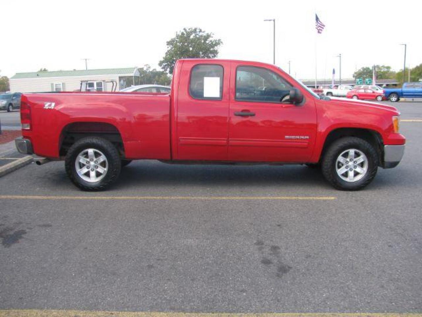 2013 Red GMC Sierra 1500 SLE Ext. Cab 4WD (1GTR2VE73DZ) with an 5.3L V8 OHV 16V FFV engine, 6-Speed Automatic transmission, located at 2443 Albert Pike, Hot Springs, AR, 71913, (501) 623-6255, 34.492222, -93.109993 - Photo#1