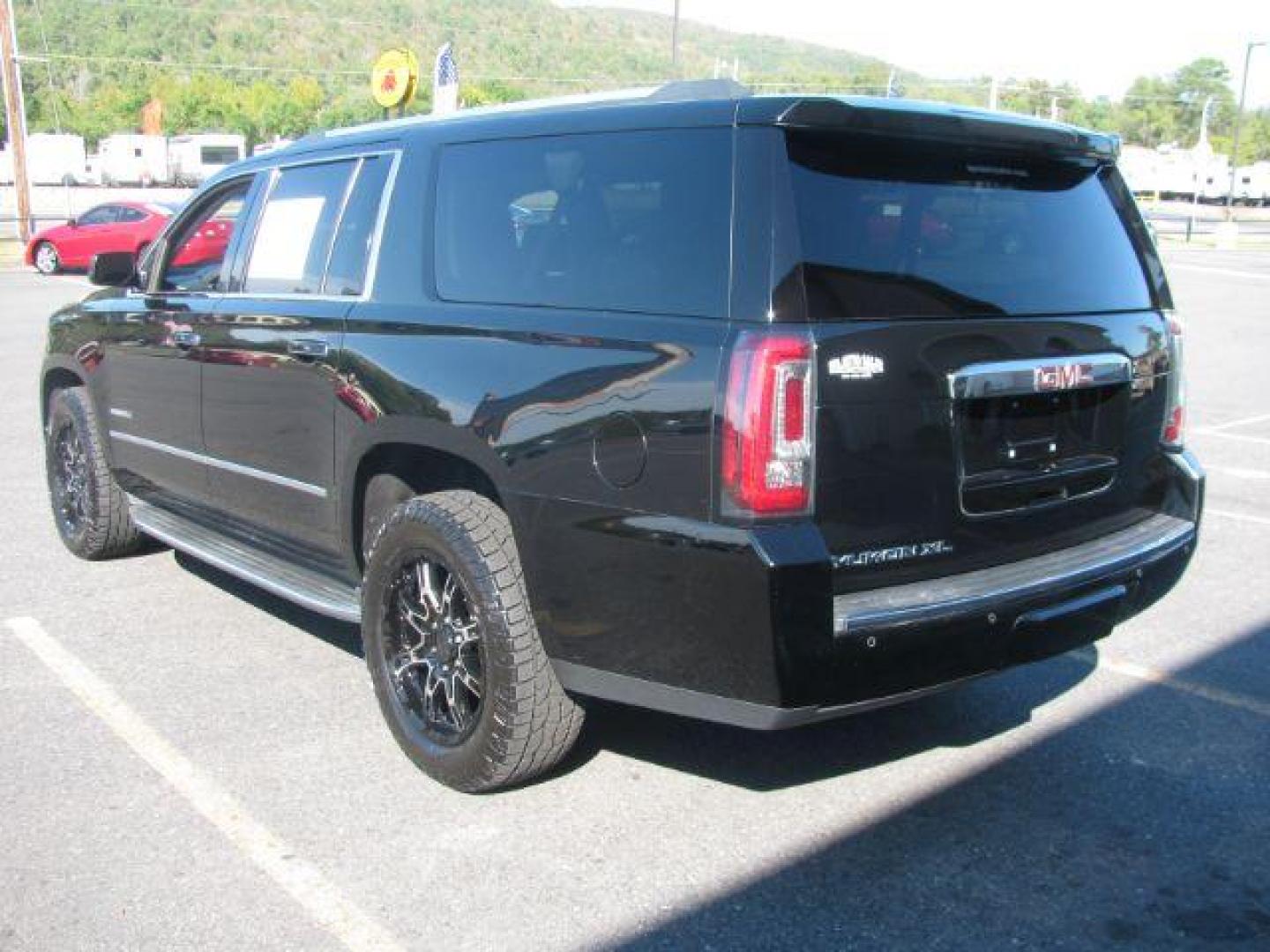 2016 Black GMC Yukon XL Denali 4WD (1GKS2HKJ1GR) with an 6.2L V8 OHV 16V engine, 6-Speed Automatic transmission, located at 2443 Albert Pike, Hot Springs, AR, 71913, (501) 623-6255, 34.492222, -93.109993 - Photo#2