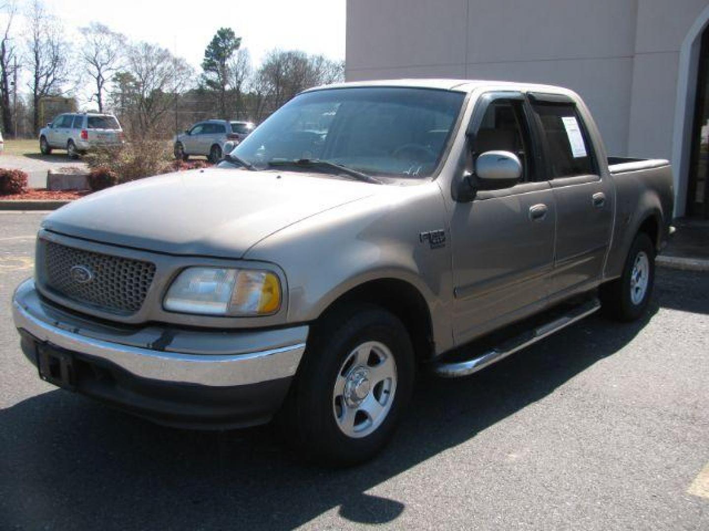 2002 Tan Ford F-150 XLT SuperCrew Short Bed 2WD (1FTRW07642K) with an 4.6L V8 SOHC 16V engine, 4-Speed Automatic transmission, located at 2443 Albert Pike, Hot Springs, AR, 71913, (501) 623-6255, 34.492222, -93.109993 - LISTED FEATURES MAY BE OPTIONAL AND NOT INCLUDED ON THIS VEHICLE!!! - Photo#0