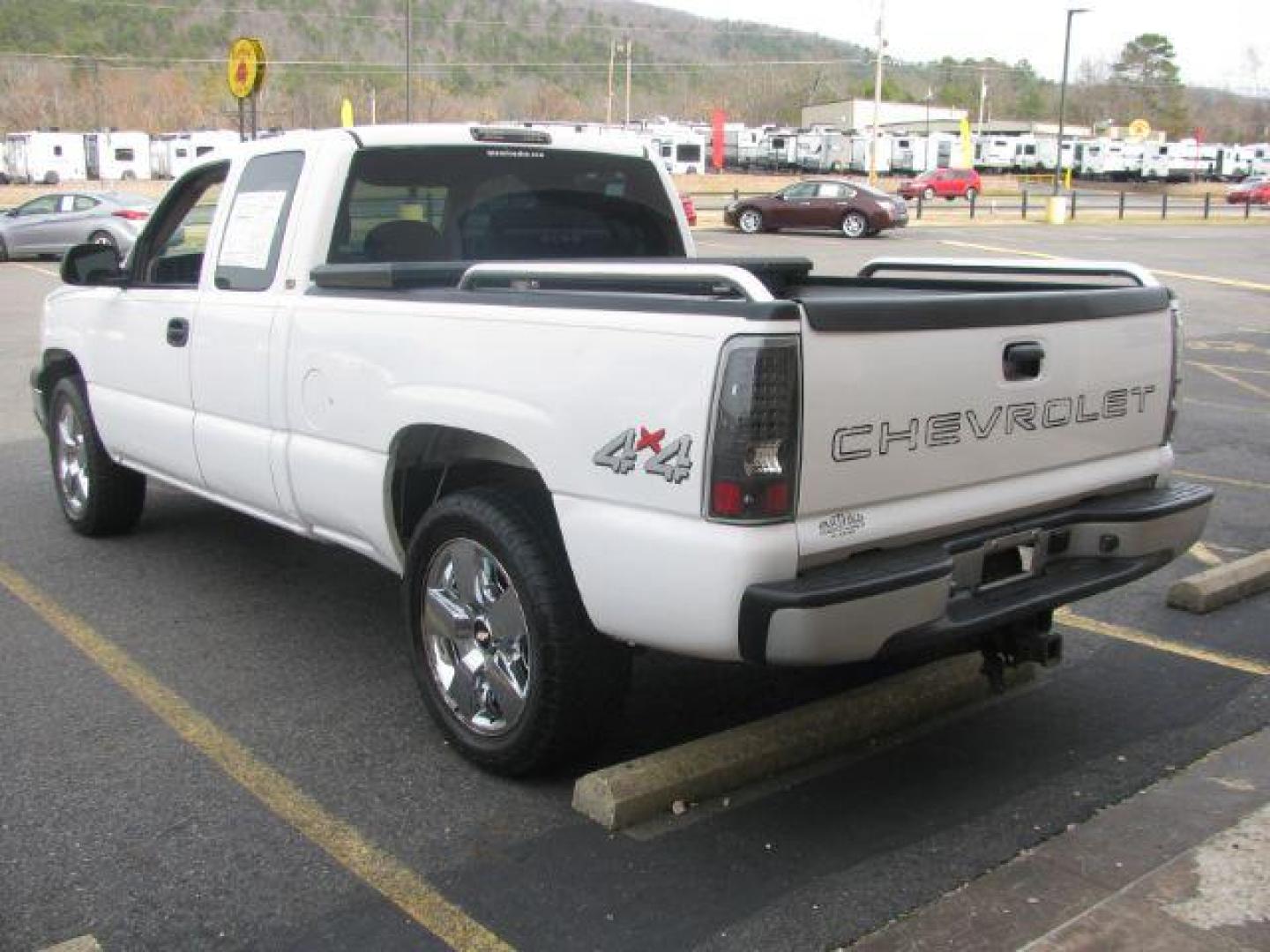 2004 White Chevrolet Silverado 1500 Work Truck Ext. Cab Short Bed 4WD (1GCEK19T74Z) with an 5.3L V8 OHV 16V engine, 4-Speed Automatic transmission, located at 2443 Albert Pike, Hot Springs, AR, 71913, (501) 623-6255, 34.492222, -93.109993 - Photo#2