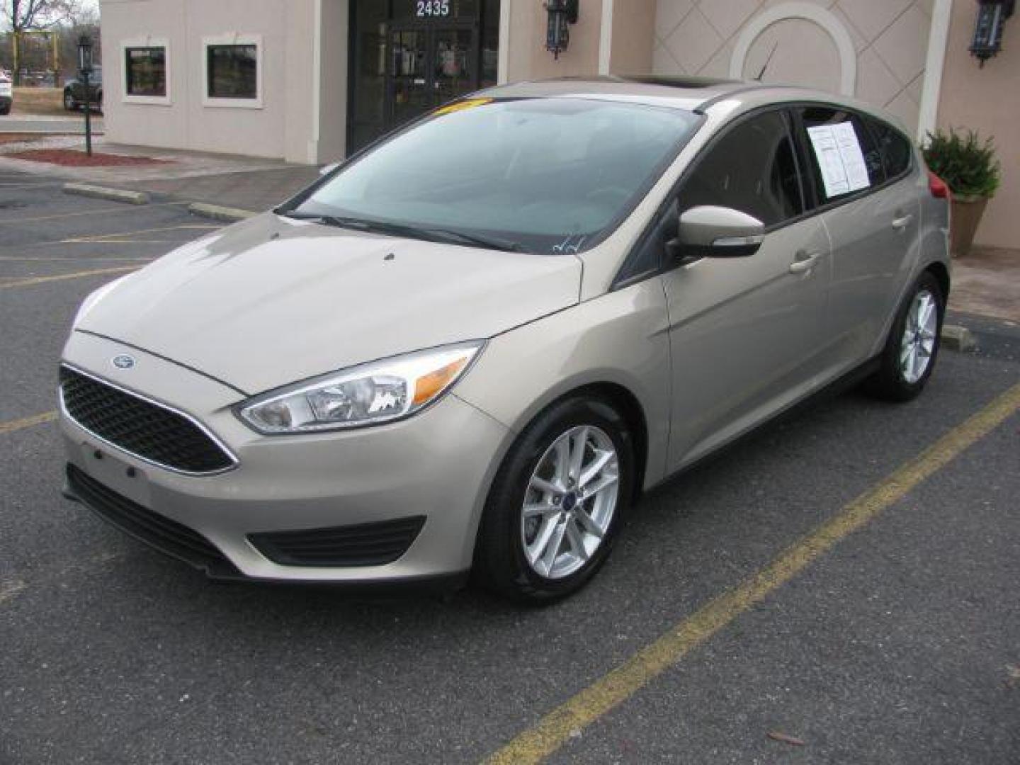 2016 Beige Ford Focus SE Hatch (1FADP3K25GL) with an 2.0L L4 DOHC 16V engine, located at 2443 Albert Pike, Hot Springs, AR, 71913, (501) 623-6255, 34.492222, -93.109993 - Photo#0