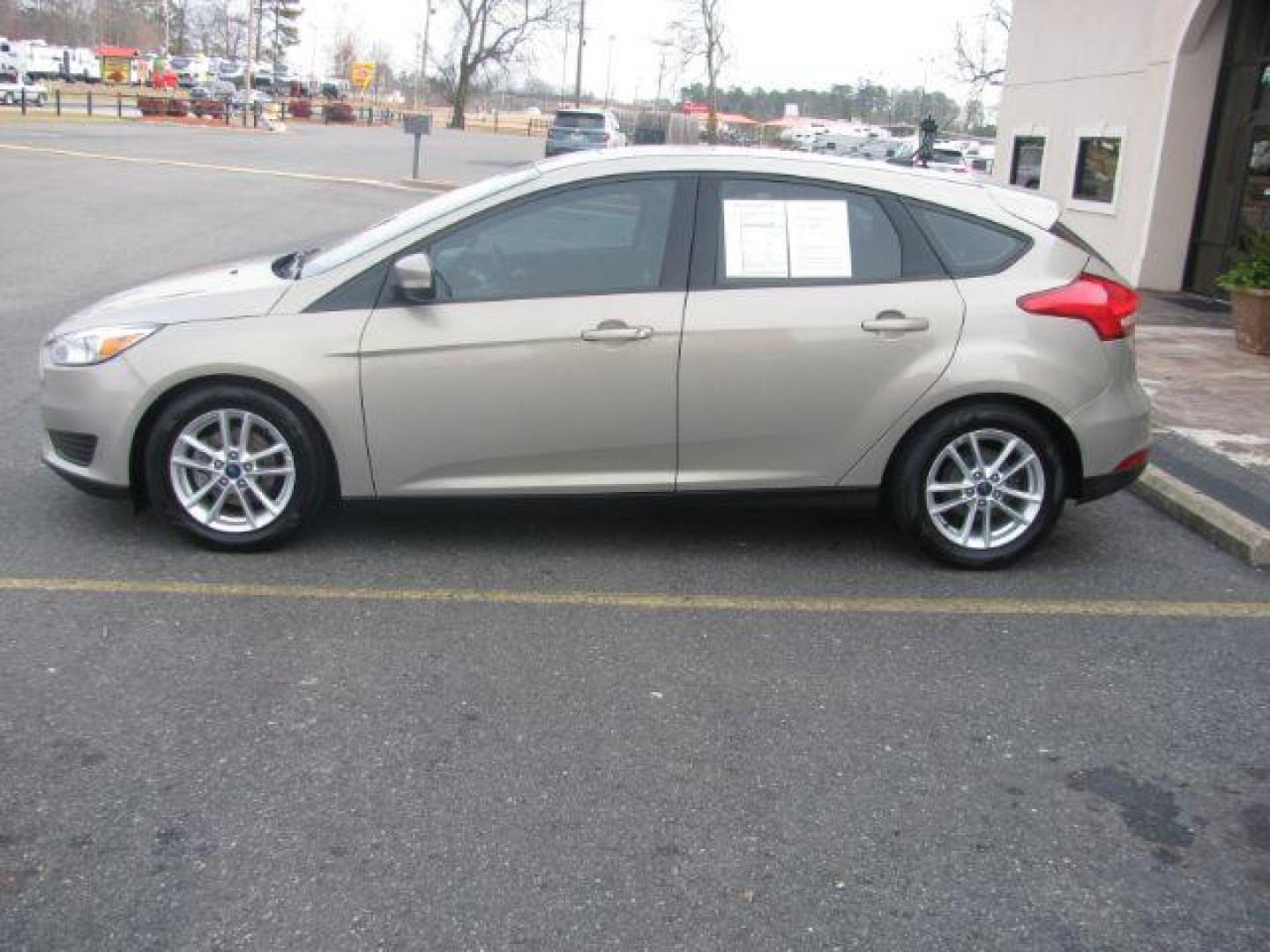 2016 Beige Ford Focus SE Hatch (1FADP3K25GL) with an 2.0L L4 DOHC 16V engine, located at 2443 Albert Pike, Hot Springs, AR, 71913, (501) 623-6255, 34.492222, -93.109993 - Photo#1