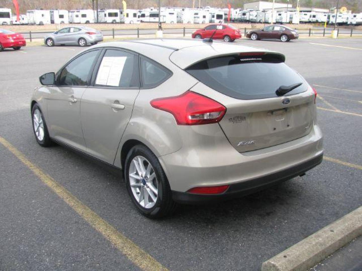 2016 Beige Ford Focus SE Hatch (1FADP3K25GL) with an 2.0L L4 DOHC 16V engine, located at 2443 Albert Pike, Hot Springs, AR, 71913, (501) 623-6255, 34.492222, -93.109993 - Photo#2