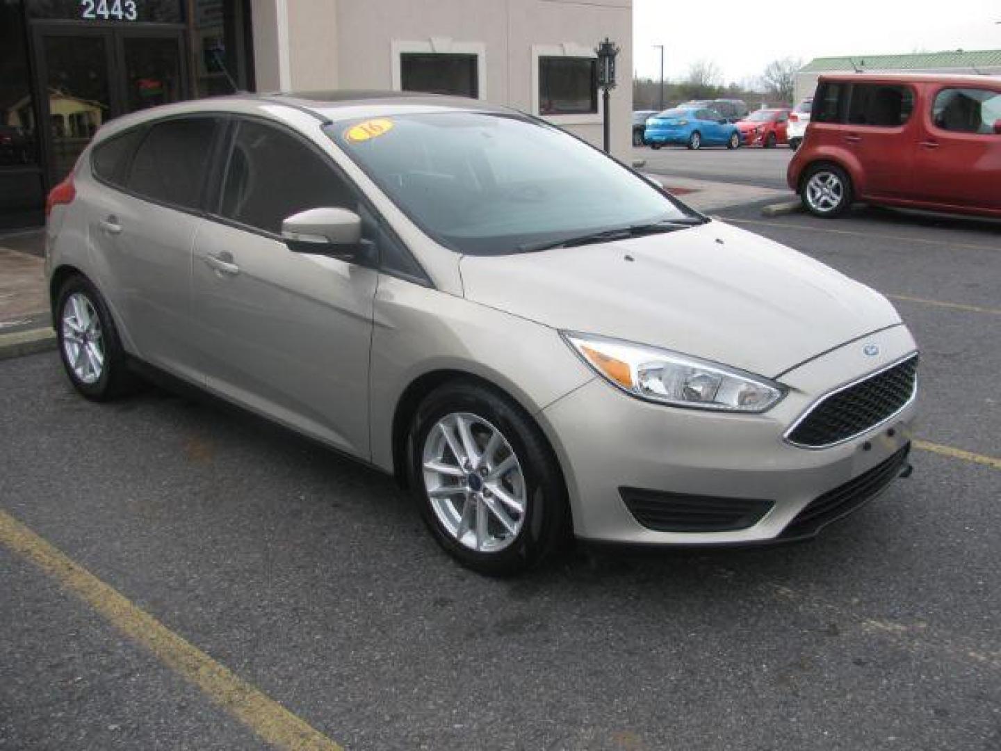 2016 Beige Ford Focus SE Hatch (1FADP3K25GL) with an 2.0L L4 DOHC 16V engine, located at 2443 Albert Pike, Hot Springs, AR, 71913, (501) 623-6255, 34.492222, -93.109993 - Photo#5