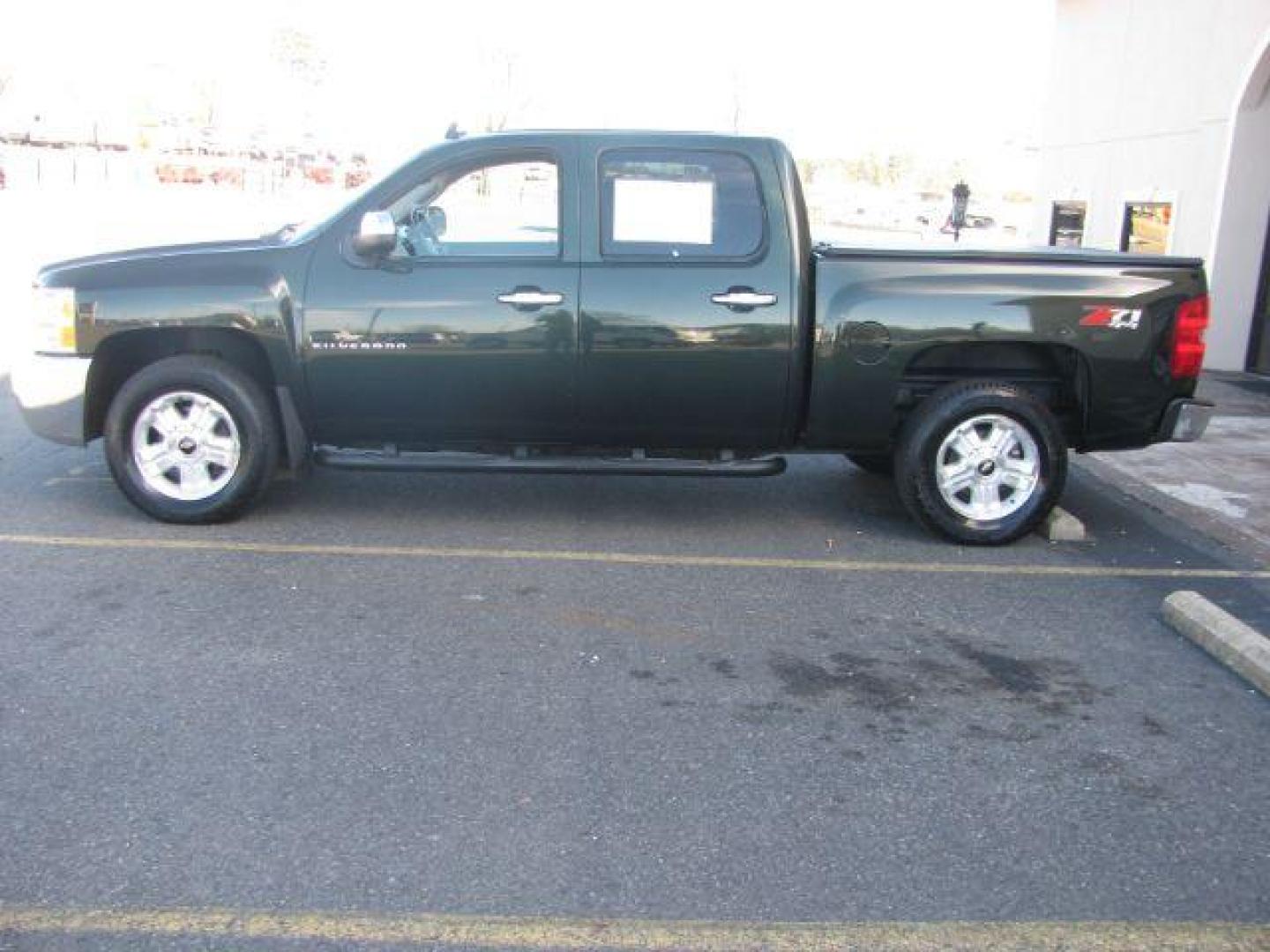 2013 Green Chevrolet Silverado 1500 LT Crew Cab 4WD (3GCPKSE70DG) with an 5.3L V8 OHV 16V FFV engine, located at 2443 Albert Pike, Hot Springs, AR, 71913, (501) 623-6255, 34.492222, -93.109993 - Photo#1