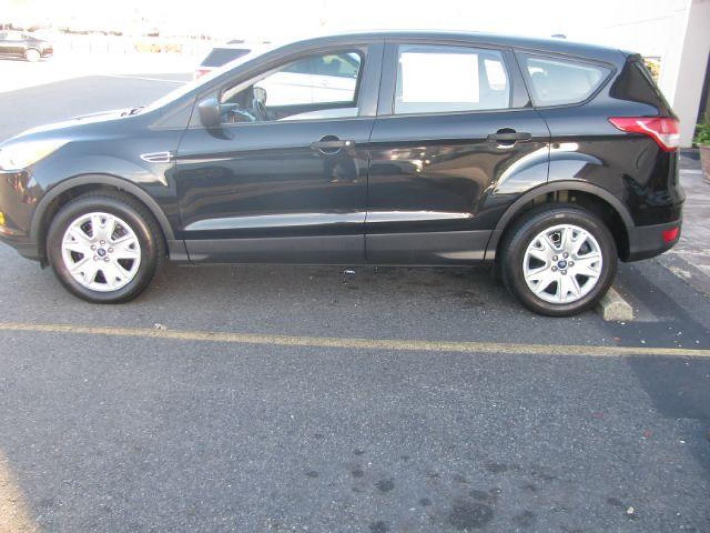 2013 Black Ford Escape S FWD (1FMCU0F7XDU) with an 2.5L L4 DOHC 16V engine, 6-Speed Automatic transmission, located at 2443 Albert Pike, Hot Springs, AR, 71913, (501) 623-6255, 34.492222, -93.109993 - Photo#1