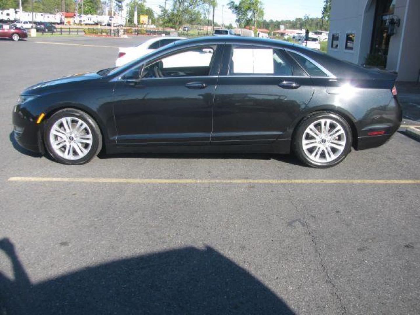 2014 Black Lincoln MKZ FWD (3LN6L2GK8ER) with an 3.7L V6 DOHC 24V engine, 6-Speed Automatic transmission, located at 2443 Albert Pike, Hot Springs, AR, 71913, (501) 623-6255, 34.492222, -93.109993 - Photo#1