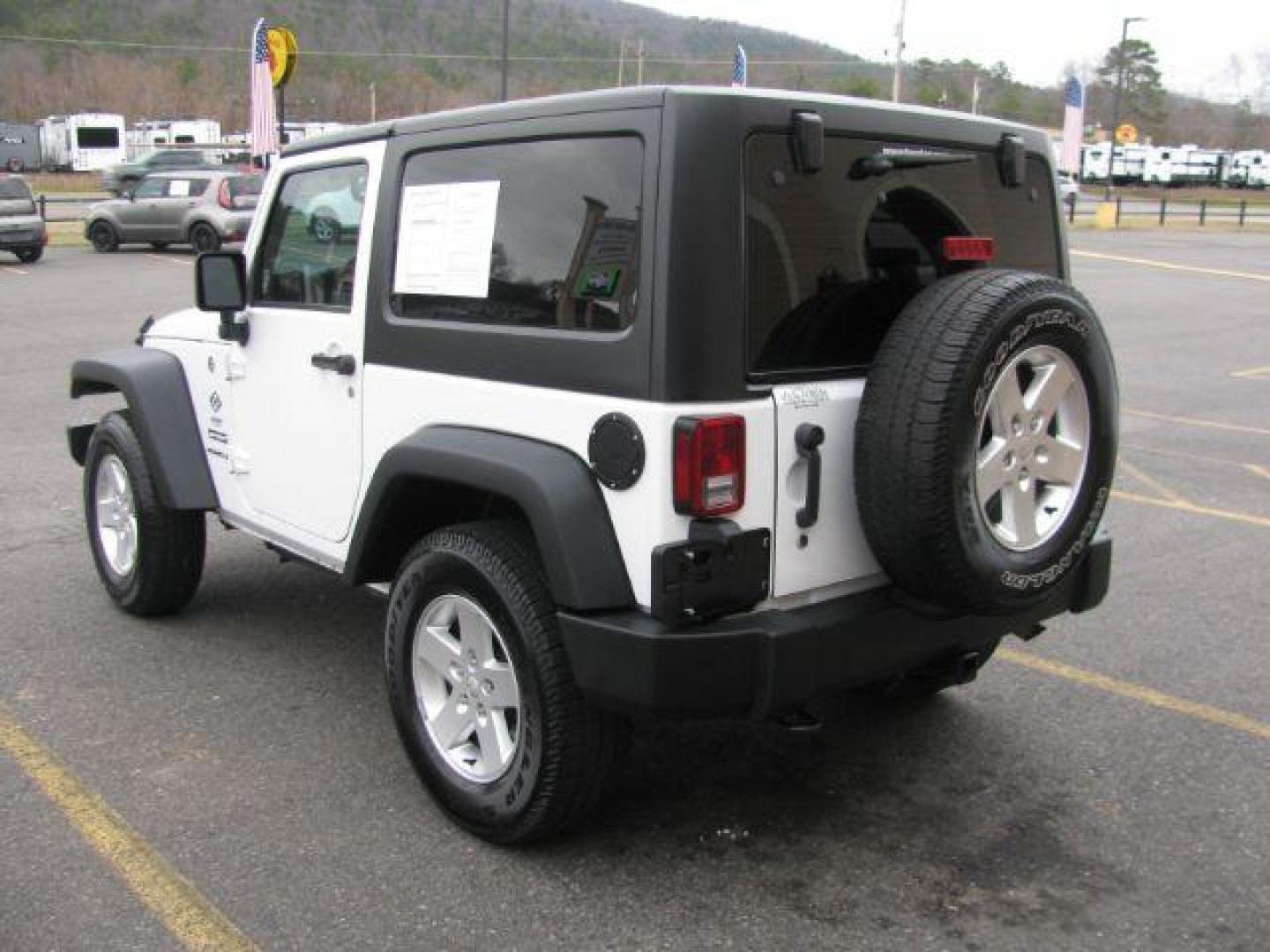 2016 White Jeep Wrangler Sport 4WD (1C4AJWAG3GL) with an 3.6L V6 DOHC 24V FFV engine, located at 2443 Albert Pike, Hot Springs, AR, 71913, (501) 623-6255, 34.492222, -93.109993 - Photo#2