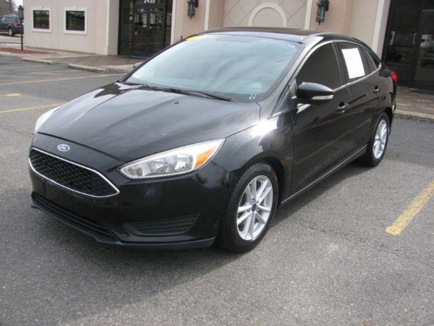 2017 Black Ford Focus SE Sedan (1FADP3F22HL) with an 2.0L L4 DOHC 16V engine, located at 2443 Albert Pike, Hot Springs, AR, 71913, (501) 623-6255, 34.492222, -93.109993 - Photo#0