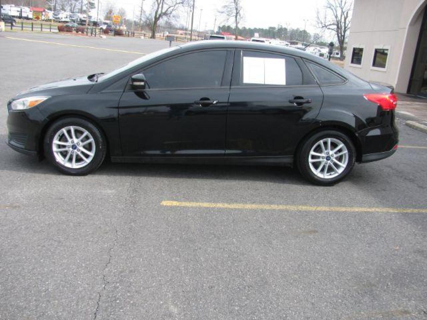 2017 Black Ford Focus SE Sedan (1FADP3F22HL) with an 2.0L L4 DOHC 16V engine, located at 2443 Albert Pike, Hot Springs, AR, 71913, (501) 623-6255, 34.492222, -93.109993 - Photo#1