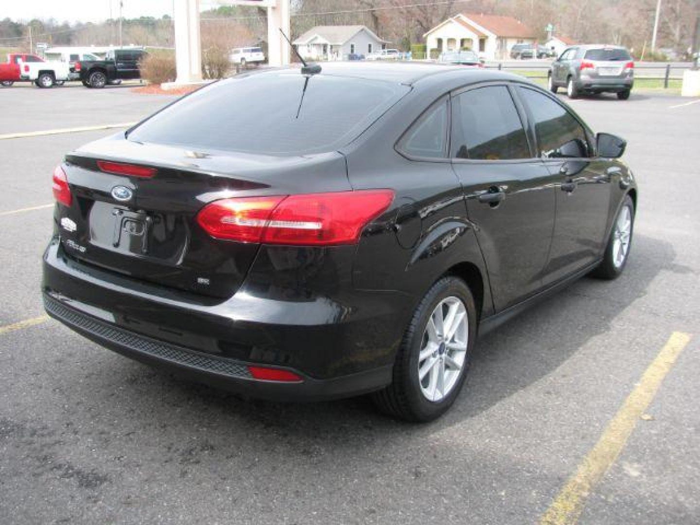 2017 Black Ford Focus SE Sedan (1FADP3F22HL) with an 2.0L L4 DOHC 16V engine, located at 2443 Albert Pike, Hot Springs, AR, 71913, (501) 623-6255, 34.492222, -93.109993 - Photo#3