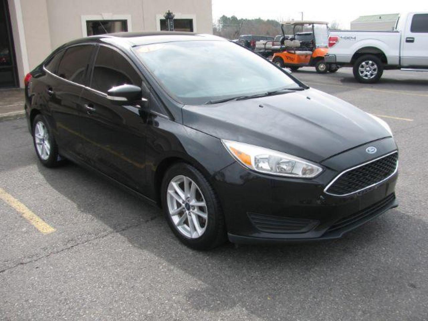 2017 Black Ford Focus SE Sedan (1FADP3F22HL) with an 2.0L L4 DOHC 16V engine, located at 2443 Albert Pike, Hot Springs, AR, 71913, (501) 623-6255, 34.492222, -93.109993 - Photo#5