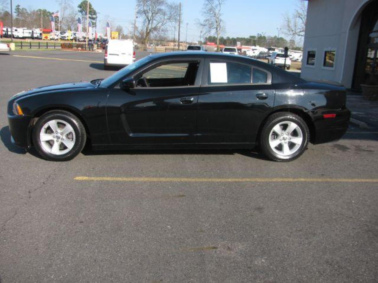 2013 Black Dodge Charger SE (2C3CDXBG9DH) with an 3.6L V6 DOHC 24V engine, 5-Speed Automatic transmission, located at 2443 Albert Pike, Hot Springs, AR, 71913, (501) 623-6255, 34.492222, -93.109993 - Photo#1