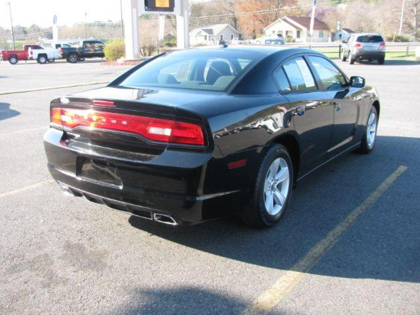 2013 Black Dodge Charger SE (2C3CDXBG9DH) with an 3.6L V6 DOHC 24V engine, 5-Speed Automatic transmission, located at 2443 Albert Pike, Hot Springs, AR, 71913, (501) 623-6255, 34.492222, -93.109993 - Photo#3