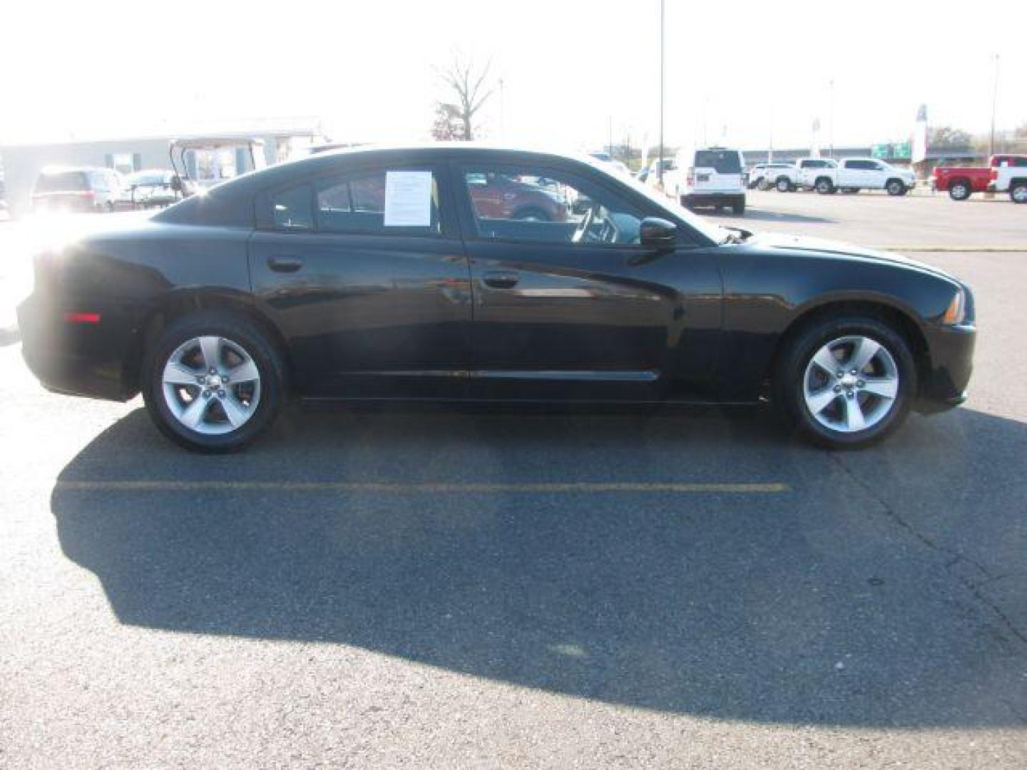 2013 Black Dodge Charger SE (2C3CDXBG9DH) with an 3.6L V6 DOHC 24V engine, 5-Speed Automatic transmission, located at 2443 Albert Pike, Hot Springs, AR, 71913, (501) 623-6255, 34.492222, -93.109993 - Photo#4