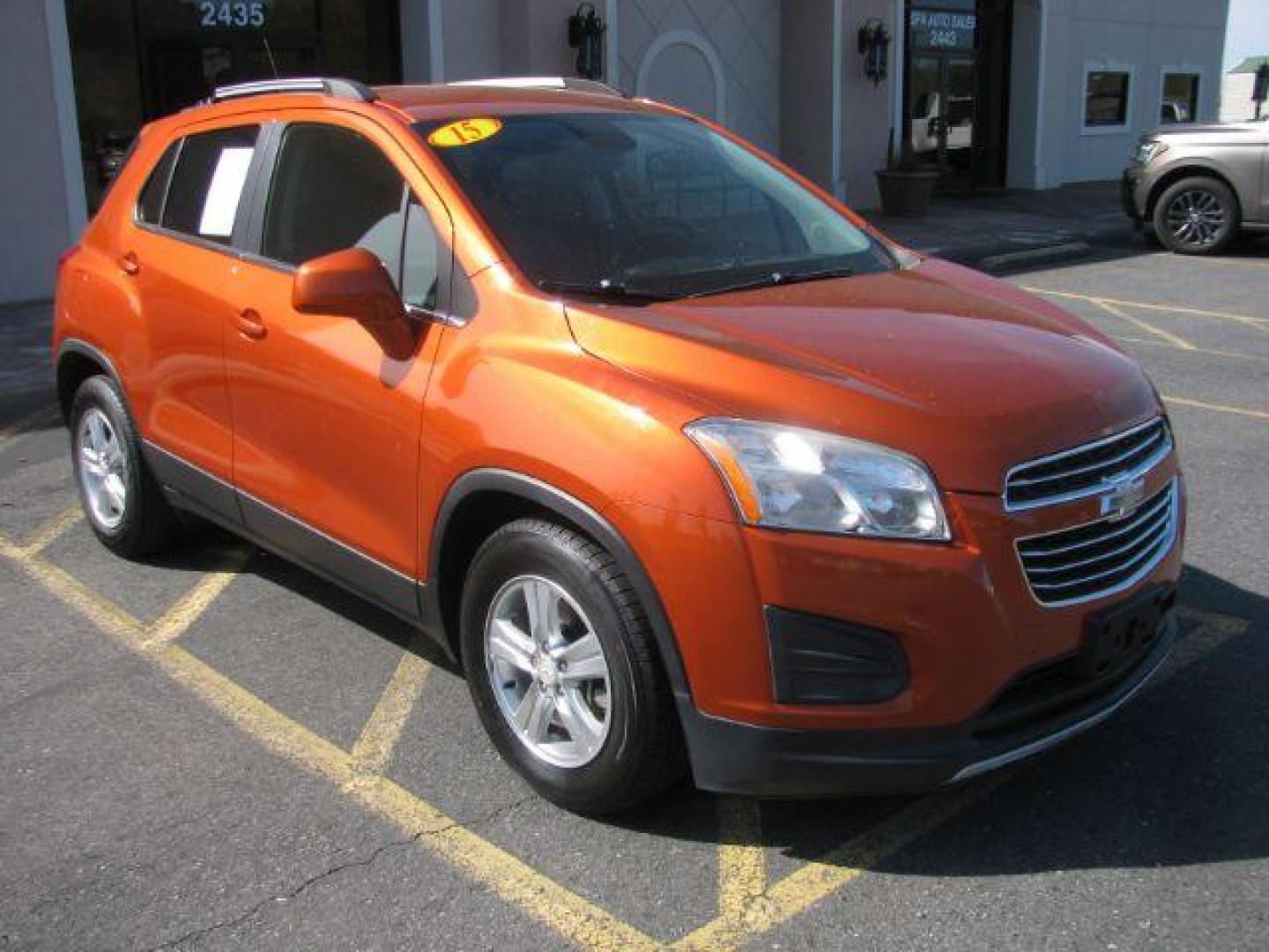 2015 Orange Chevrolet Trax LT FWD (KL7CJLSBXFB) with an 1.4L L4 DOHC 16V engine, 6-Speed Automatic transmission, located at 2443 Albert Pike, Hot Springs, AR, 71913, (501) 623-6255, 34.492222, -93.109993 - Photo#0