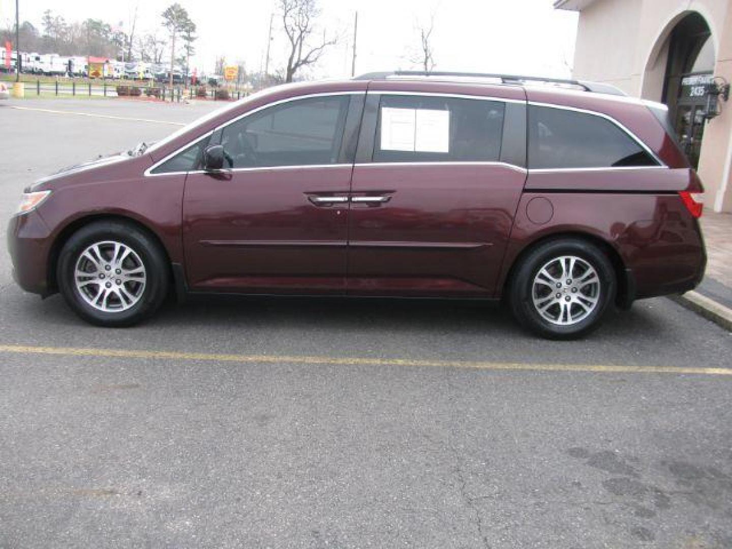 2012 Maroon Honda Odyssey EX-L (5FNRL5H63CB) with an 3.5L V6 SOHC 24V engine, 5-Speed Automatic transmission, located at 2443 Albert Pike, Hot Springs, AR, 71913, (501) 623-6255, 34.492222, -93.109993 - Photo#1