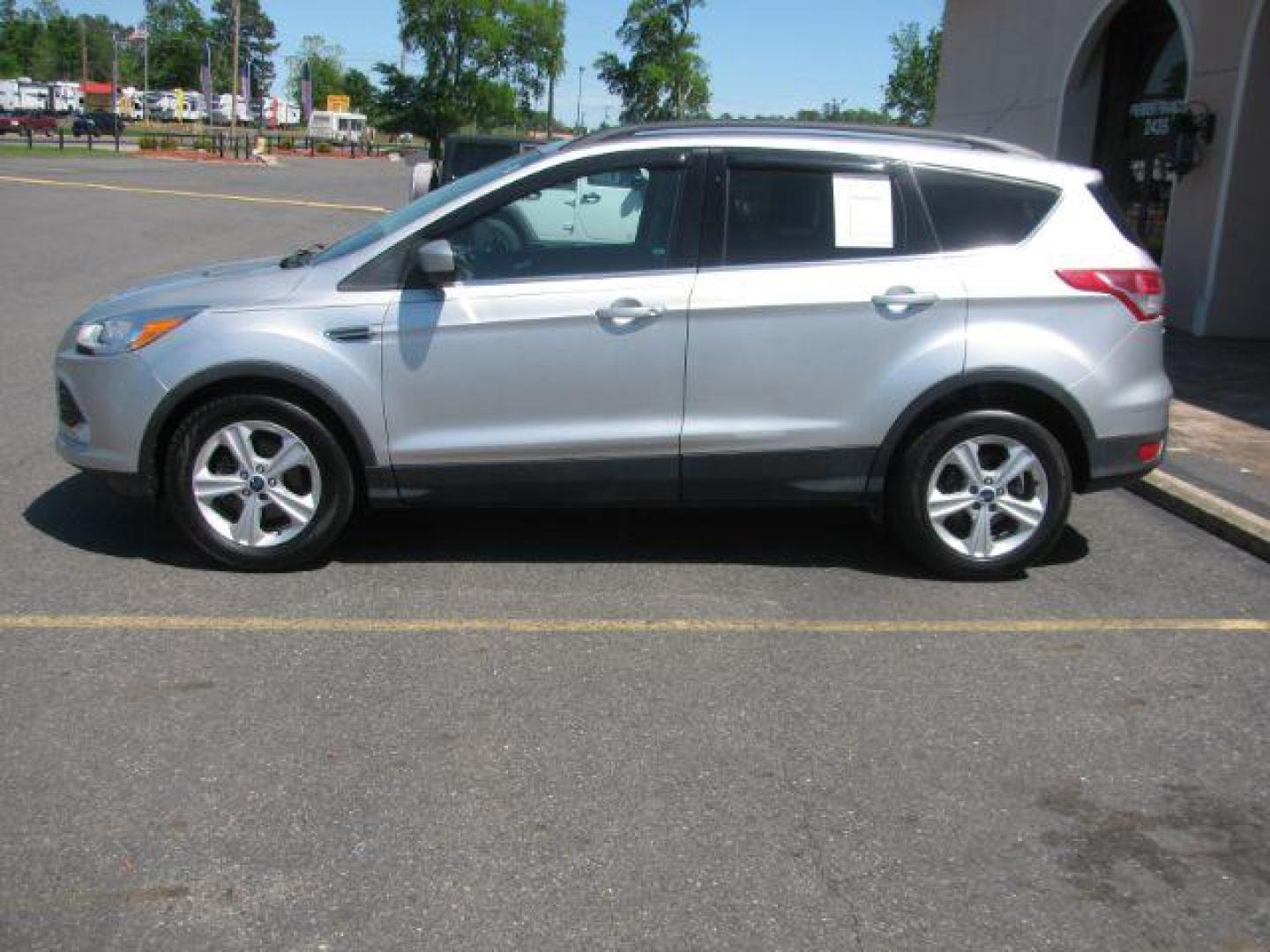 2015 Silver Ford Escape SE FWD (1FMCU0GX2FU) with an 1.6L L4 DOHC 16V engine, 6-Speed Automatic transmission, located at 2443 Albert Pike, Hot Springs, AR, 71913, (501) 623-6255, 34.492222, -93.109993 - Photo#1