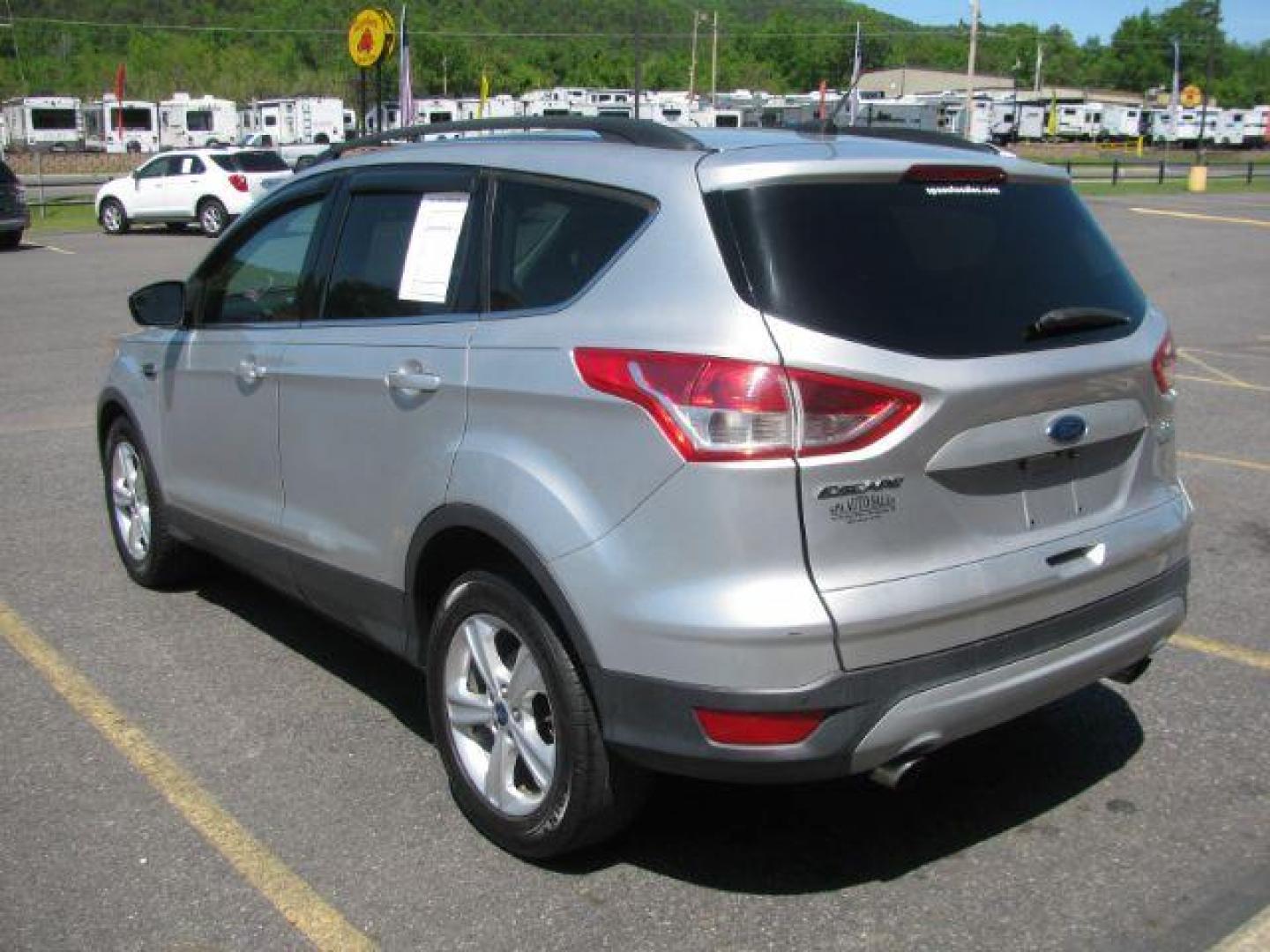 2015 Silver Ford Escape SE FWD (1FMCU0GX2FU) with an 1.6L L4 DOHC 16V engine, 6-Speed Automatic transmission, located at 2443 Albert Pike, Hot Springs, AR, 71913, (501) 623-6255, 34.492222, -93.109993 - Photo#2