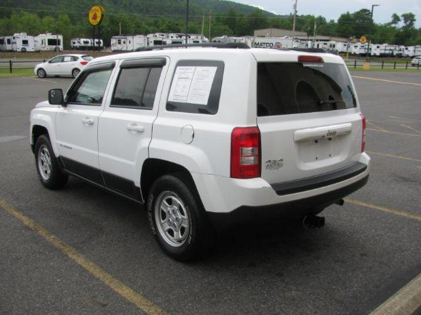 2016 White Jeep Patriot Sport 4WD (1C4NJRBB8GD) with an 2.4L L4 DOHC 16V engine, located at 2443 Albert Pike, Hot Springs, AR, 71913, (501) 623-6255, 34.492222, -93.109993 - Photo#2