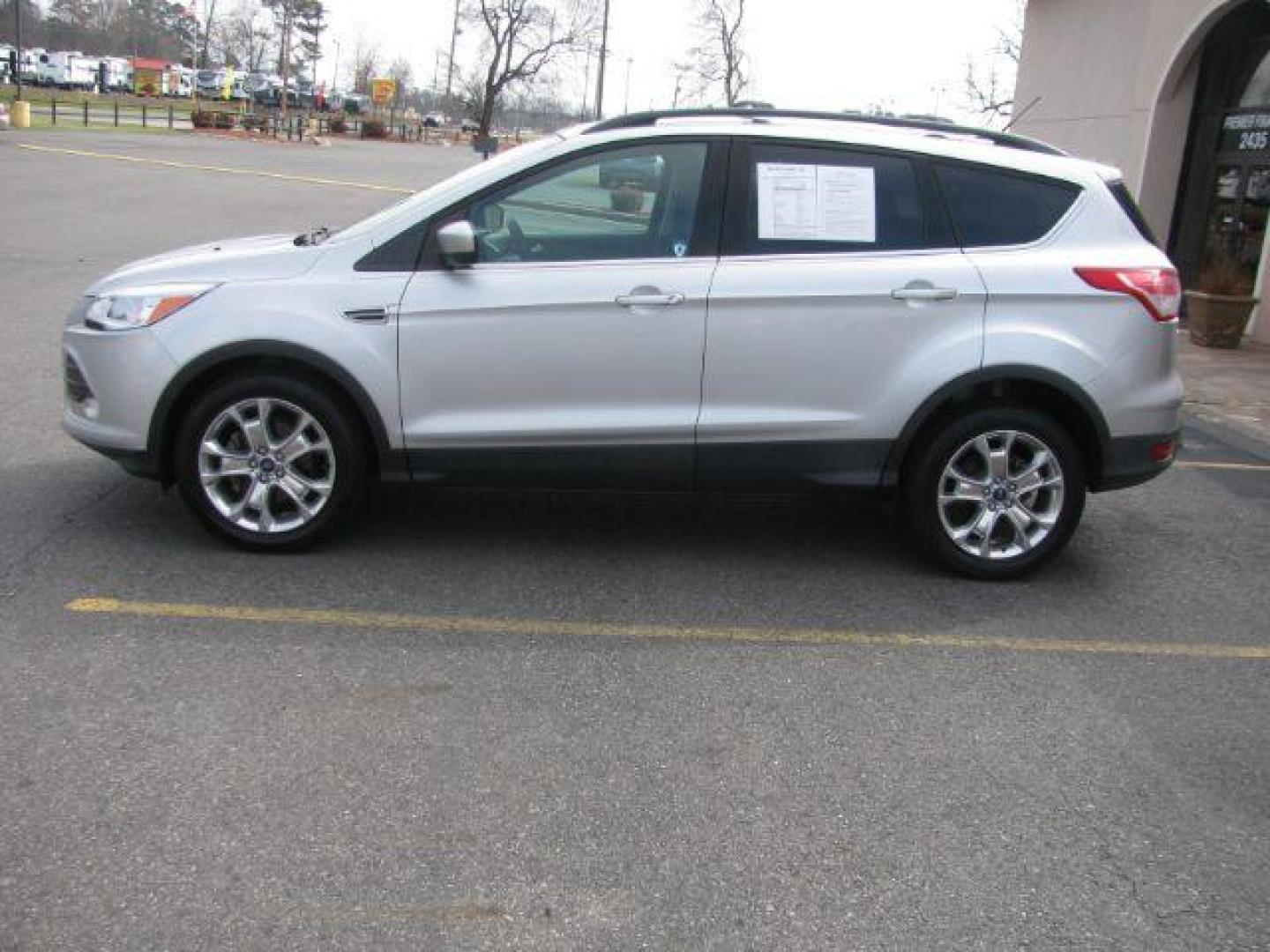 2013 Silver Ford Escape SE FWD (1FMCU0GX7DU) with an 1.6L L4 DOHC 16V engine, 6-Speed Automatic transmission, located at 2443 Albert Pike, Hot Springs, AR, 71913, (501) 623-6255, 34.492222, -93.109993 - Photo#1