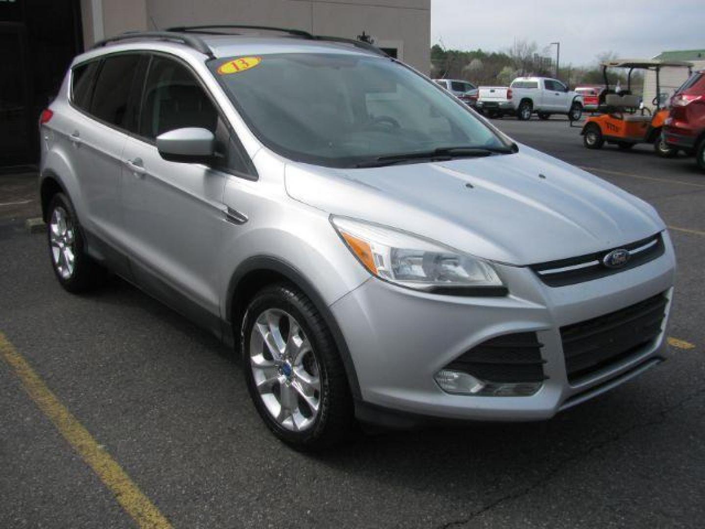 2013 Silver Ford Escape SE FWD (1FMCU0GX7DU) with an 1.6L L4 DOHC 16V engine, 6-Speed Automatic transmission, located at 2443 Albert Pike, Hot Springs, AR, 71913, (501) 623-6255, 34.492222, -93.109993 - Photo#5