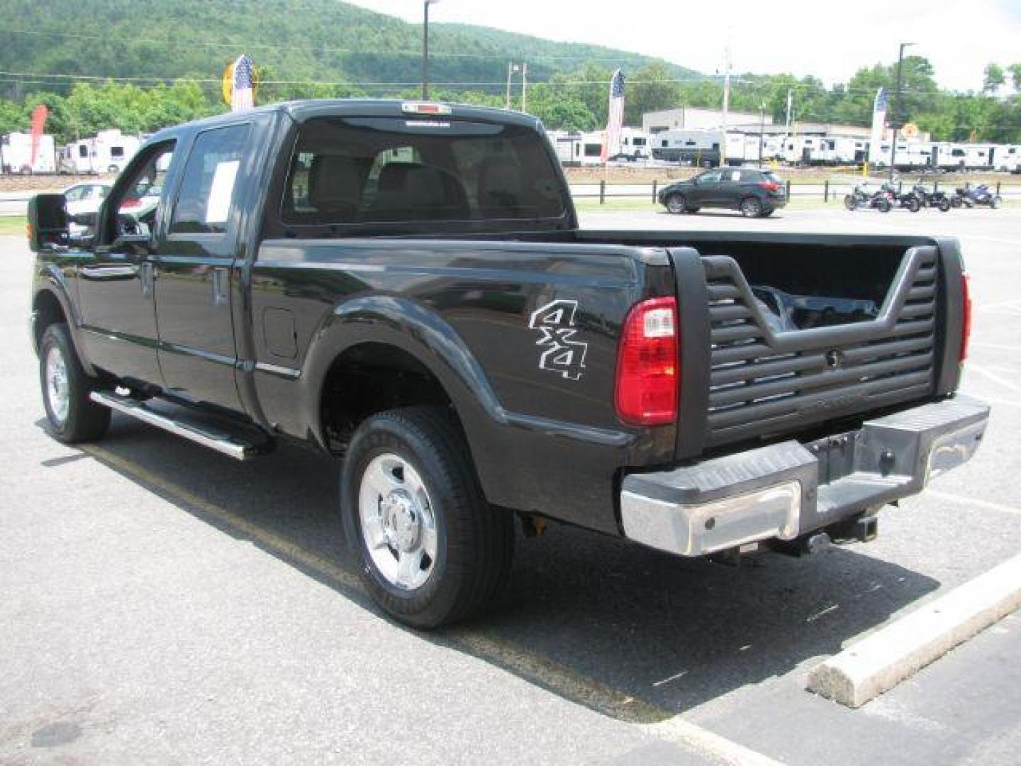 2015 Black Ford F-250 SD XLT Crew Cab 4WD (1FT7W2B66FE) with an 6.2L V8 OHV 16V engine, 6-Speed Automatic transmission, located at 2443 Albert Pike, Hot Springs, AR, 71913, (501) 623-6255, 34.492222, -93.109993 - Photo#2