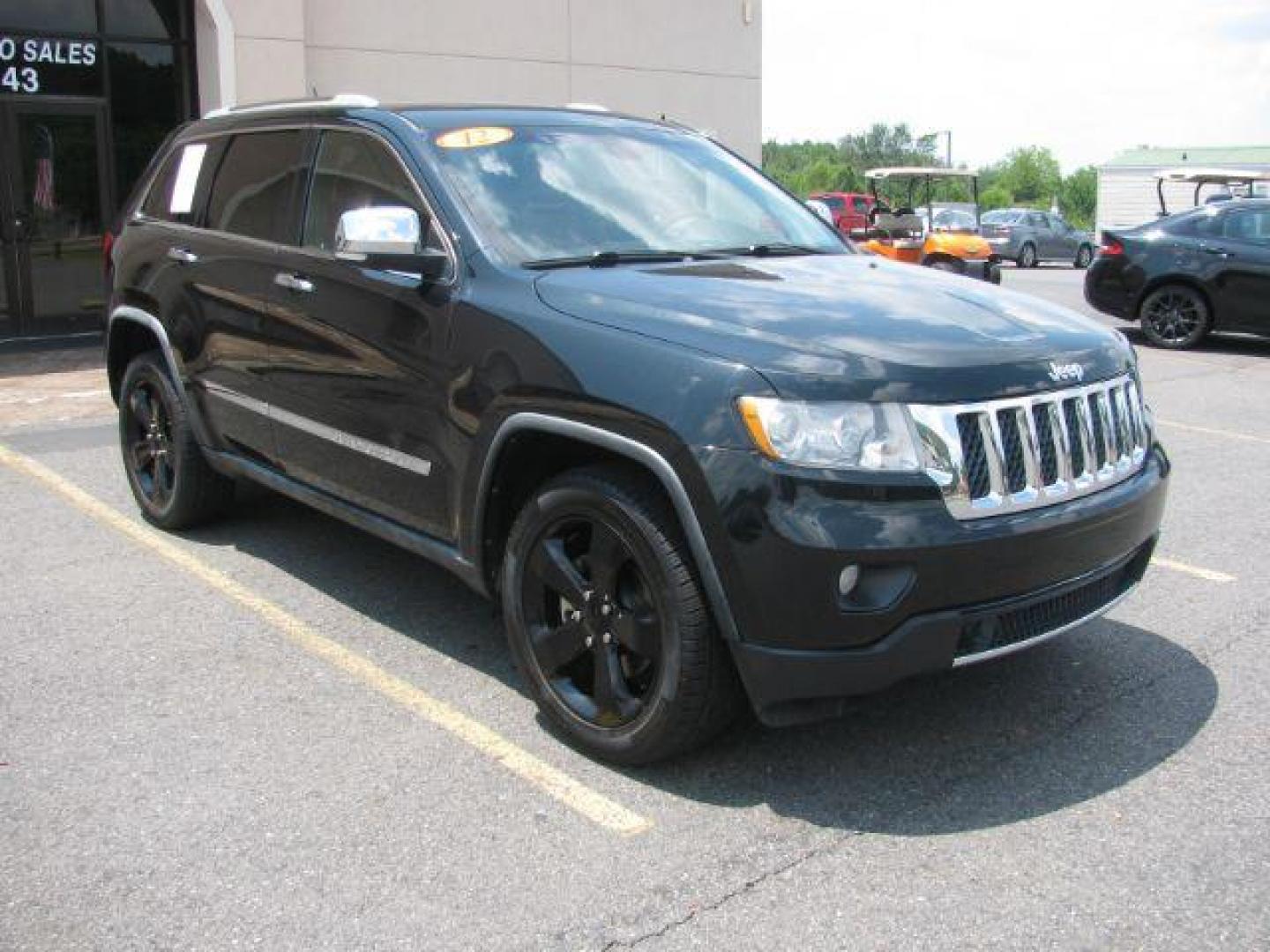 2012 Black Jeep Grand Cherokee Overland 2WD (1C4RJECG2CC) with an 3.6L V6 DOHC 24V engine, 5-Speed Automatic transmission, located at 2443 Albert Pike, Hot Springs, AR, 71913, (501) 623-6255, 34.492222, -93.109993 - Photo#0