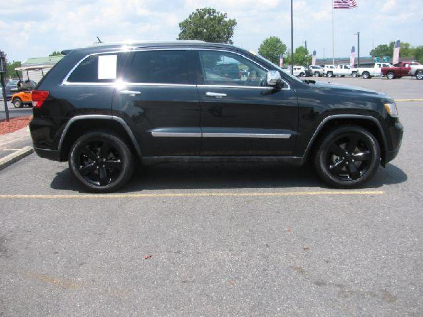 2012 Black Jeep Grand Cherokee Overland 2WD (1C4RJECG2CC) with an 3.6L V6 DOHC 24V engine, 5-Speed Automatic transmission, located at 2443 Albert Pike, Hot Springs, AR, 71913, (501) 623-6255, 34.492222, -93.109993 - Photo#1