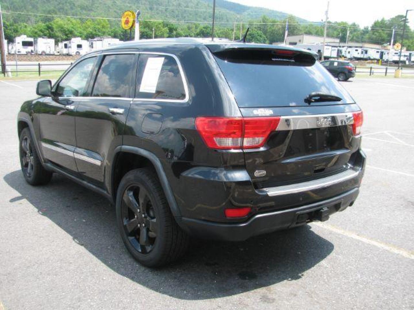 2012 Black Jeep Grand Cherokee Overland 2WD (1C4RJECG2CC) with an 3.6L V6 DOHC 24V engine, 5-Speed Automatic transmission, located at 2443 Albert Pike, Hot Springs, AR, 71913, (501) 623-6255, 34.492222, -93.109993 - Photo#3