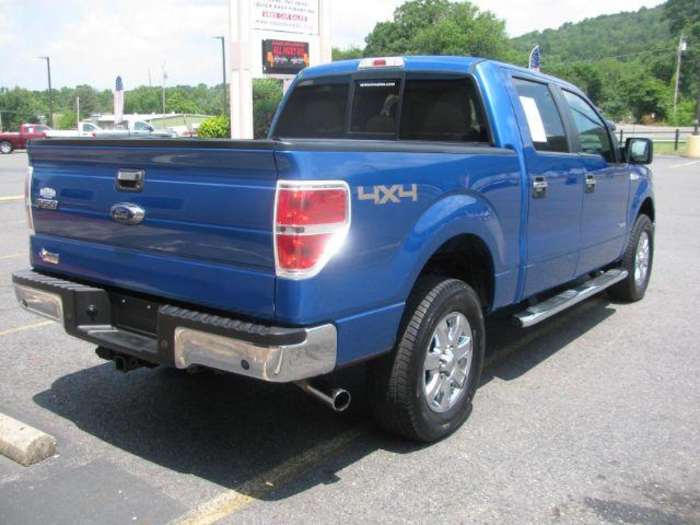 2014 Blue Ford F-150 XLT SuperCrew 5.5-ft. Bed 4WD (1FTFW1ET3EK) with an 3.5L V6 TURBO engine, 6-Speed Automatic transmission, located at 2443 Albert Pike, Hot Springs, AR, 71913, (501) 623-6255, 34.492222, -93.109993 - Photo#2