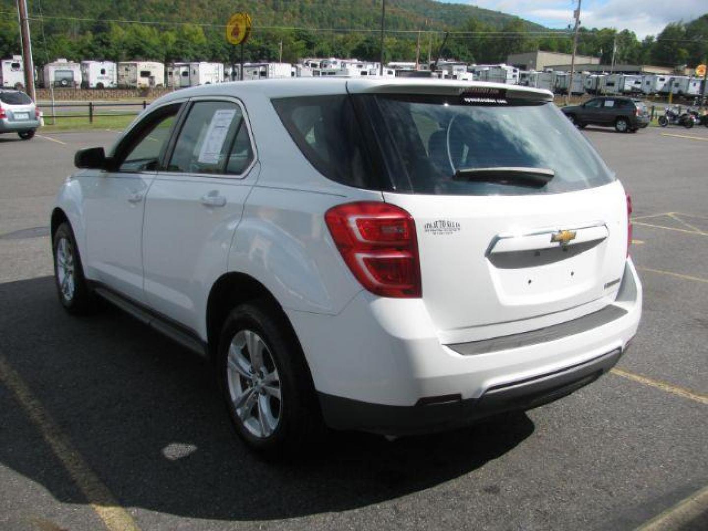 2016 White Chevrolet Equinox LS 2WD (2GNALBEK0G1) with an 2.4L L4 DOHC 16V FFV engine, 6-Speed Automatic transmission, located at 2443 Albert Pike, Hot Springs, AR, 71913, (501) 623-6255, 34.492222, -93.109993 - Photo#3