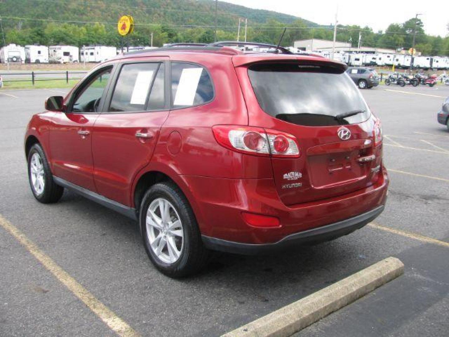 2010 Maroon Hyundai Santa Fe Limited 2.4 FWD (5NMSK3AB0AH) with an 2.4L L4 DOHC 16V engine, 6-Speed Automatic transmission, located at 2443 Albert Pike, Hot Springs, AR, 71913, (501) 623-6255, 34.492222, -93.109993 - Photo#3