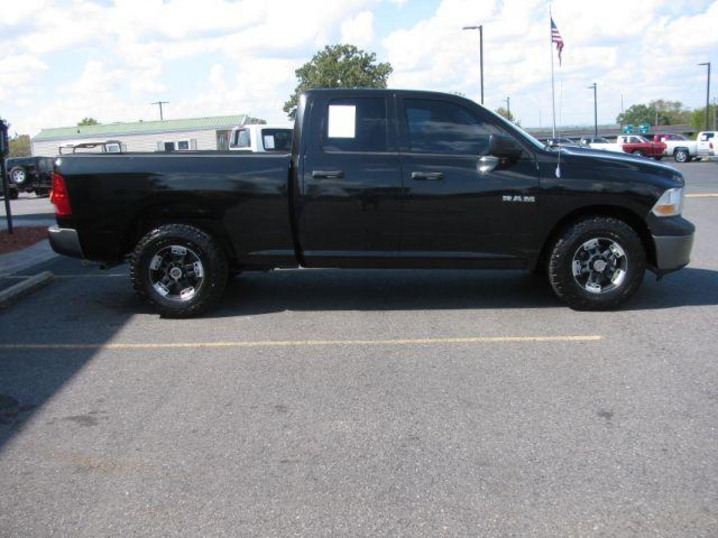 2010 Black RAM 1500 ST Quad Cab 4WD (1D7RV1GP4AS) with an 4.7L V8 SOHC 16V engine, 5-Speed Automatic transmission, located at 2443 Albert Pike, Hot Springs, AR, 71913, (501) 623-6255, 34.492222, -93.109993 - Photo#1