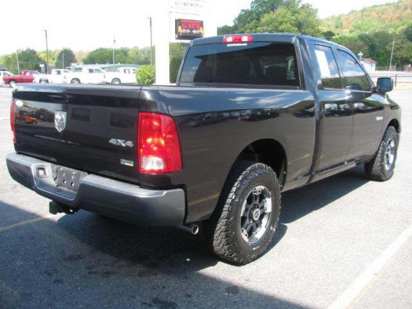 2010 Black RAM 1500 ST Quad Cab 4WD (1D7RV1GP4AS) with an 4.7L V8 SOHC 16V engine, 5-Speed Automatic transmission, located at 2443 Albert Pike, Hot Springs, AR, 71913, (501) 623-6255, 34.492222, -93.109993 - Photo#2